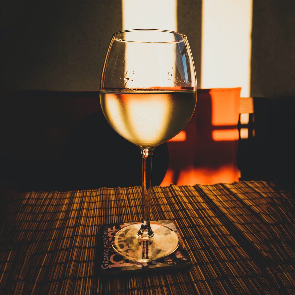 balcony-drink-sq glass on table outside